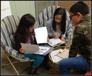 kids working on math project vacation